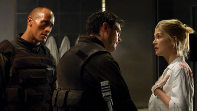 Rosamund Pike Says Her Doom Film With The Rock Was ’In all probability One of many Worst Movies Ever Made’ and ’Might Have Ended My Profession’